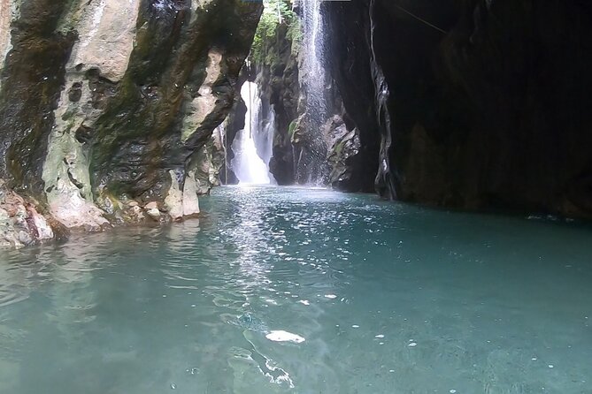Canyoning in the water - Kourtaliotiko Gorge - Rappelling beside the waterfall