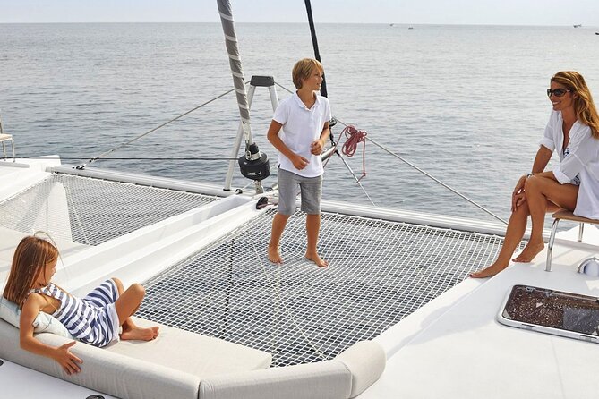 Chania: Private Day Catamaran Cruise with Swimming and Meal - A quiet bay at Agioi Theodoroi