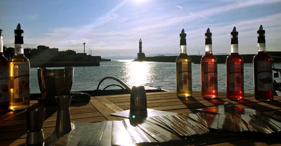 Chania: Wine, Food, and Sunset Tour with 3-Course Dinner - A sunset view beyond the main harbor crowds
