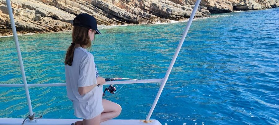 Crete: Fishing & Swimming Boat Cruise with Lunch & Drinks - Fresh fish, Greek salad, and lunch on deck