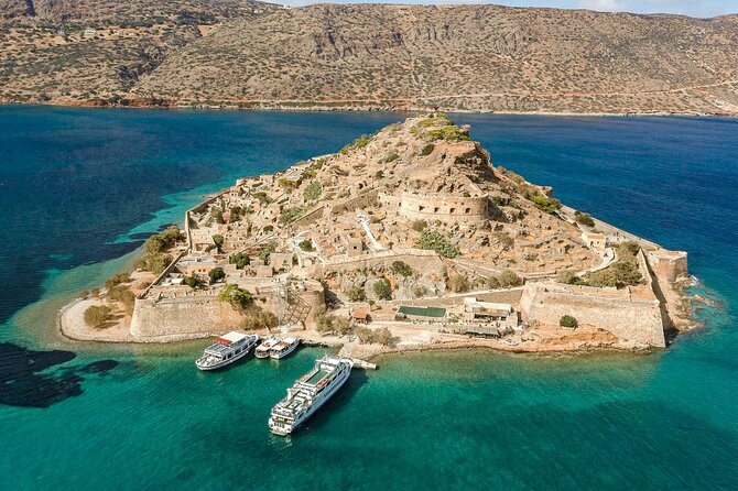 Elounda: Spinalonga Prof. Guided Boat Tour w/ BBQ + Swimming - Along the coast toward Kolokytha