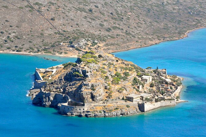Elounda: Spinalonga Prof. Guided Boat Tour w/ BBQ + Swimming - Walking through Spinalonga’s layered past