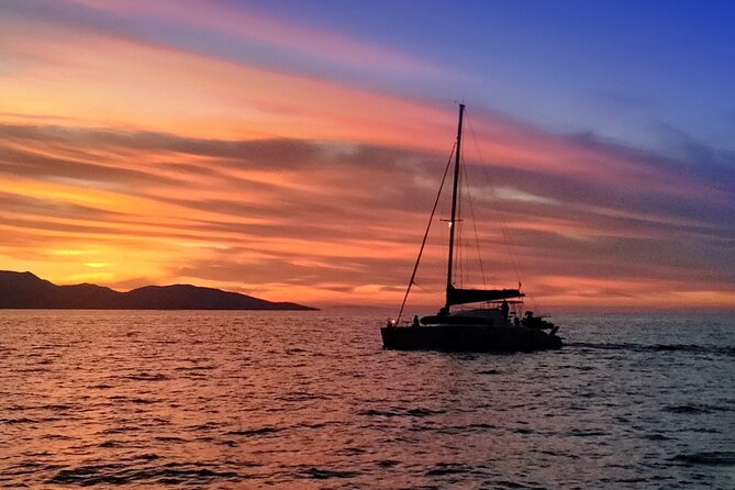 Hersonissos: Luxury Sunset Catamaran Cruise Sushi & Open Bar - Sailing out from Hersonissos toward Saint George Bay