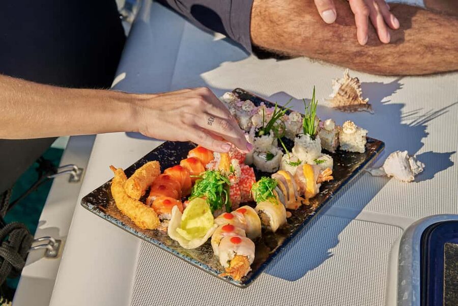 Hersonissos: Sunset Catamaran Cruise with Snacks and Drinks - The first hour: sailing out from Crete