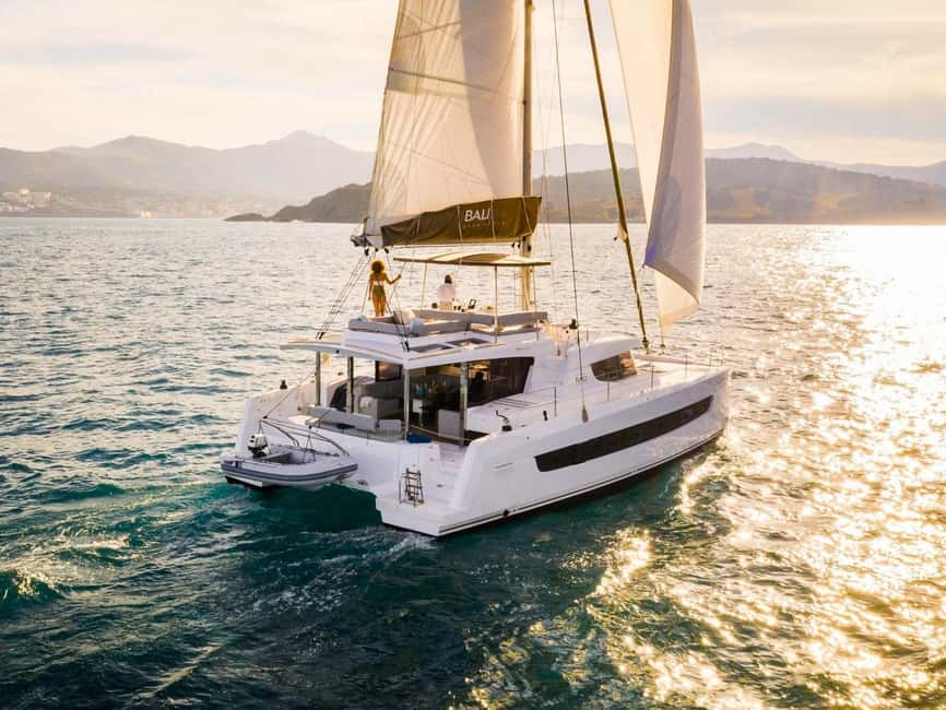 Panormo: Sunset All-Inclusive Catamaran Cruise with Snacks - Setting Sail From Panormo in the Cooler Evening