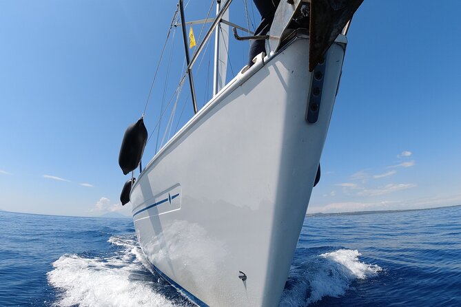 Sailing Cruises Chania - Sailing past the Lighthouse of Chania